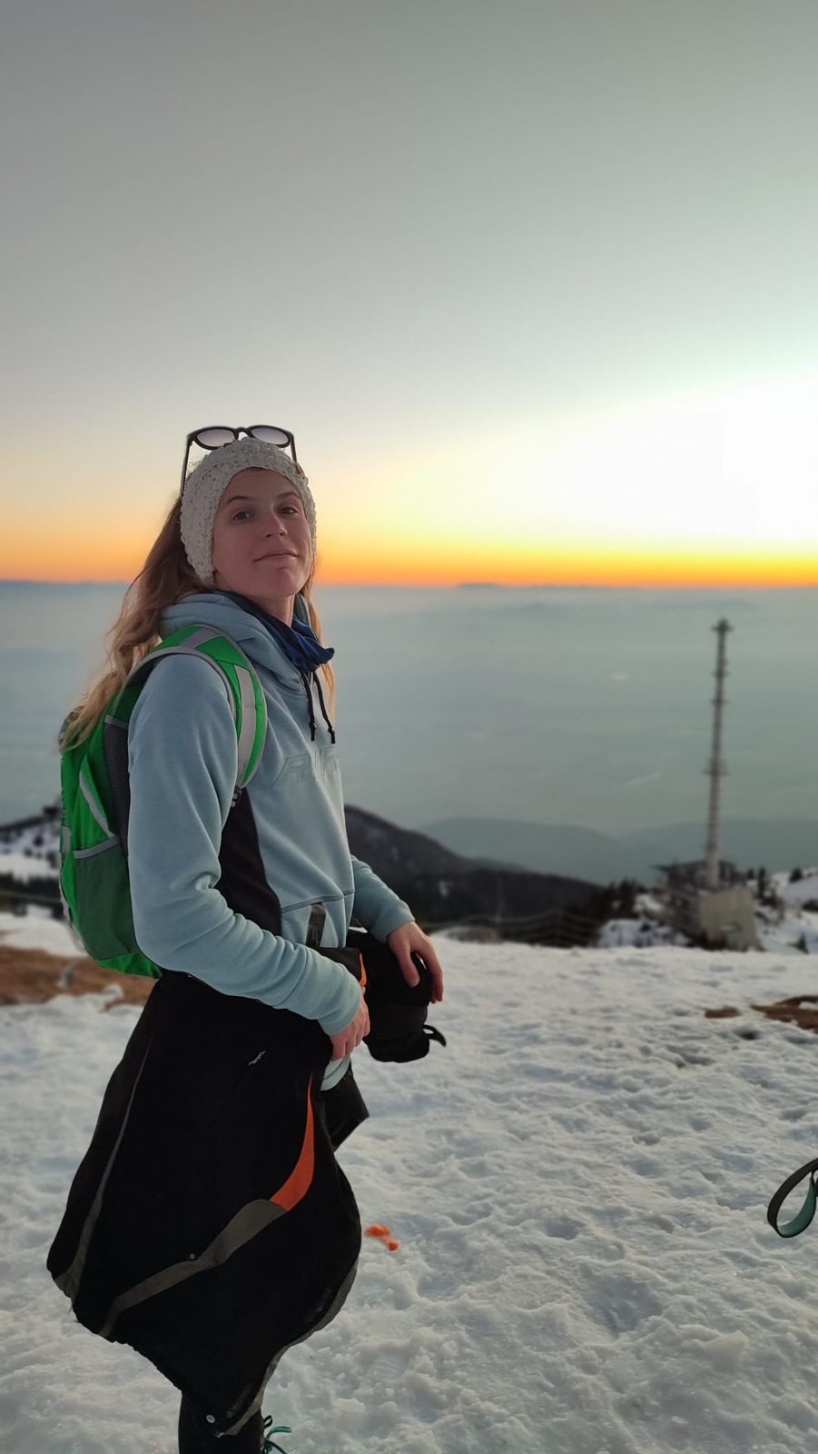 Živa on a winter sunrise hike above the clouds in Slovenia