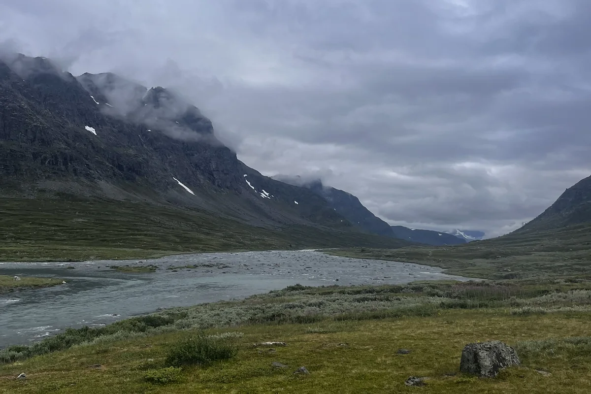 River valley under misty mountains on the Kungsleden trail in Swedish Lapland